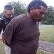 This image captured from bodycam video released by the Childersburg (Ala.) Police Department and provided by attorney Harry Daniels shows Michael Jennings, right, in custody in Childersburg, Ala., on Sunday, May 22, 2022. Jennings was helping out a friend by watering flowers when officers showed up and placed him under arrest within moments.